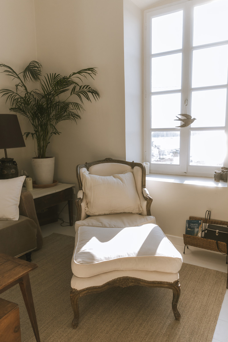 A white chair in a living room