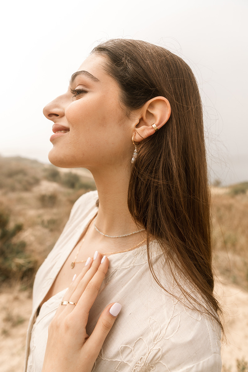 girl wearing jewellery, profile