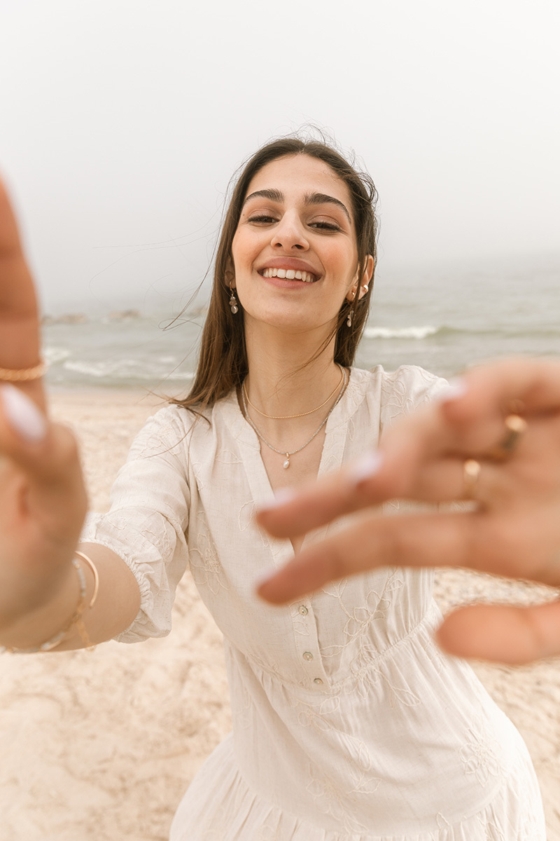 girl on the beach wearing jewellery