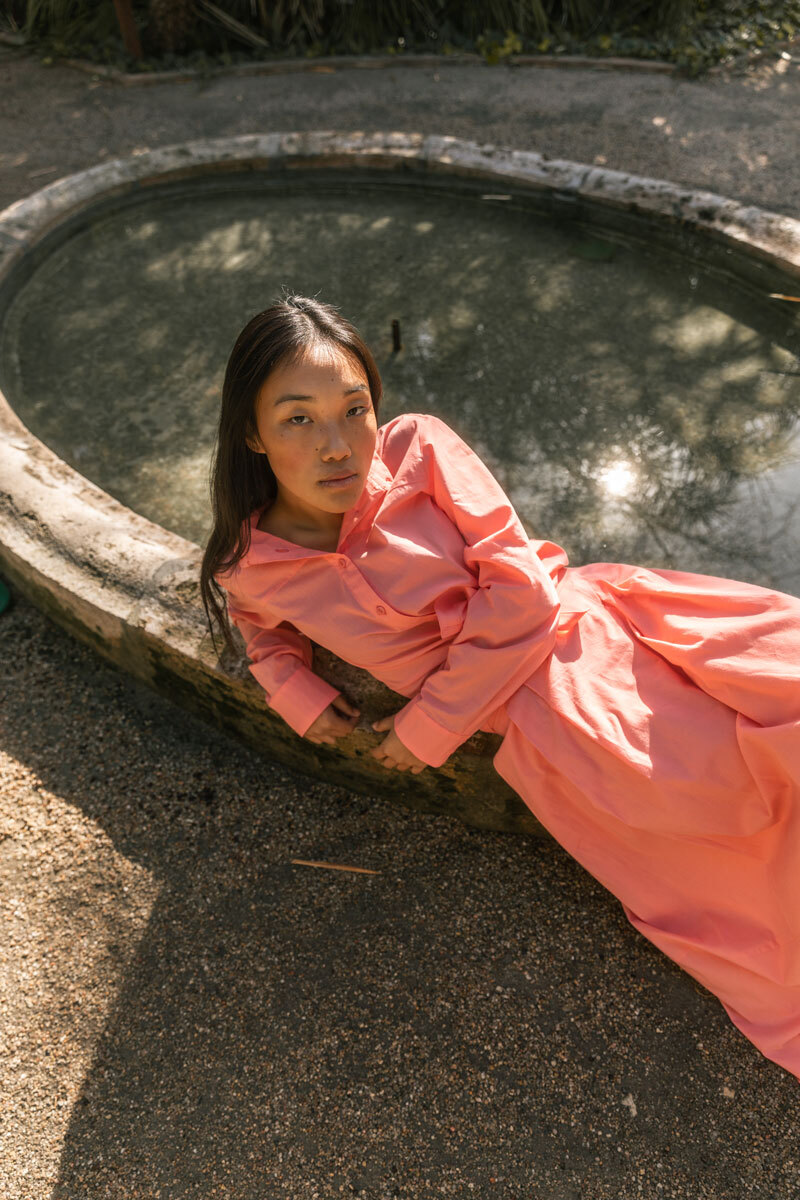 Girl lying on a fountain.