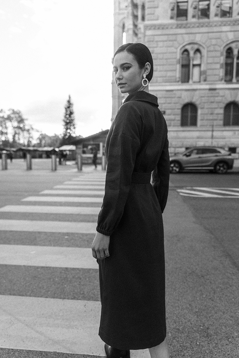 black and white photo of girl on a street crossing