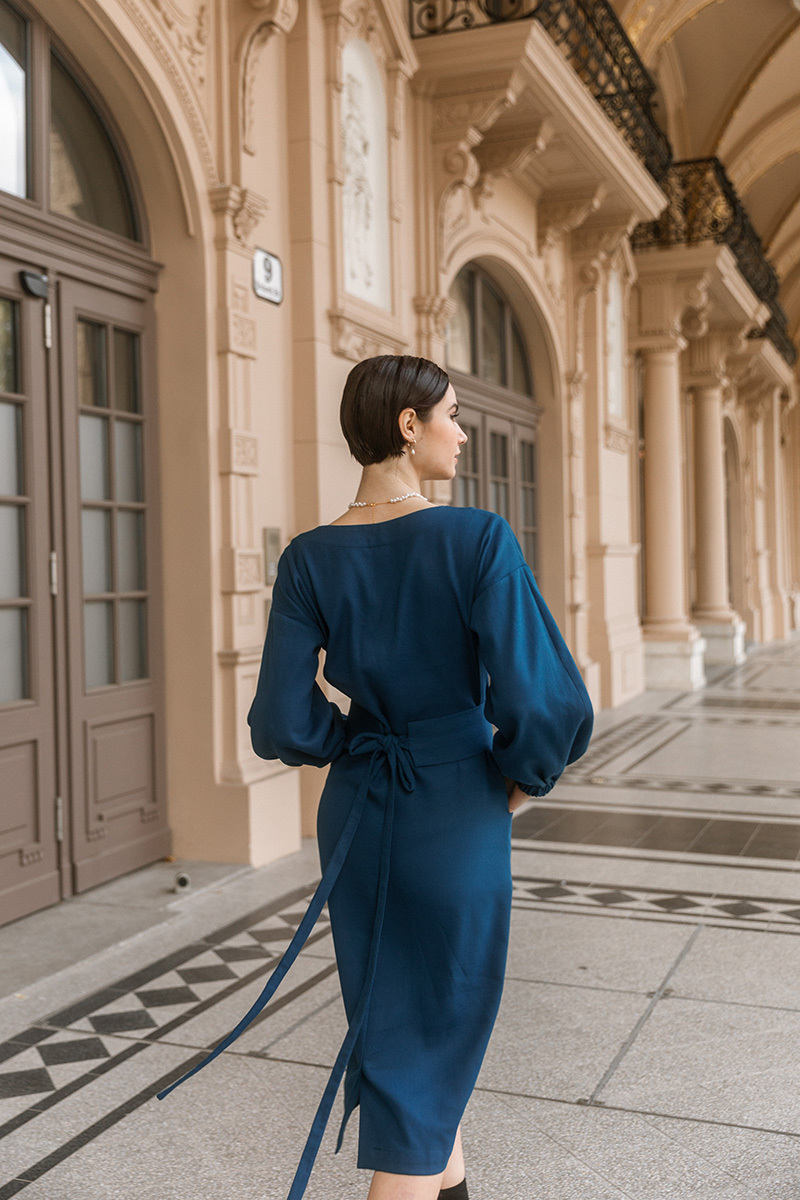 girl in blue dress walking, photo of the back