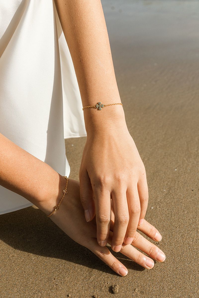 girl with hands in the sand