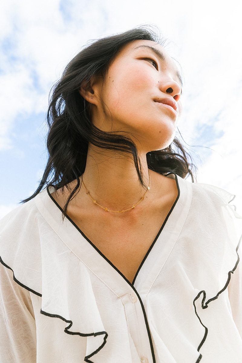 girl standing infront of the camera, black hair leaned into camera