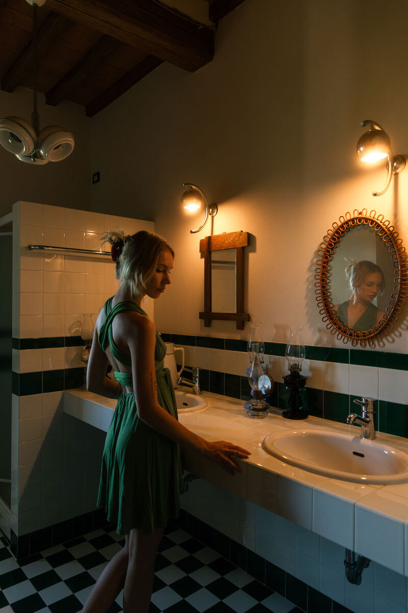 girl standing in a bathroom