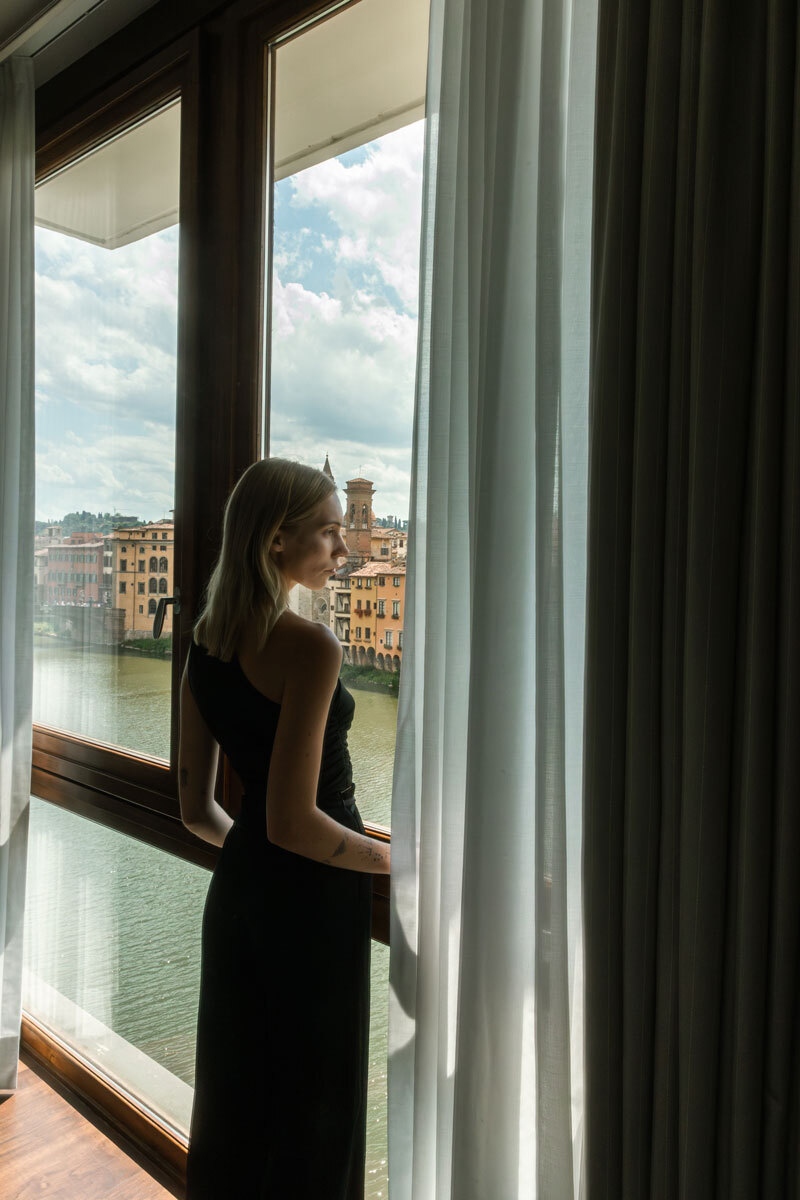 person standing in front of a window