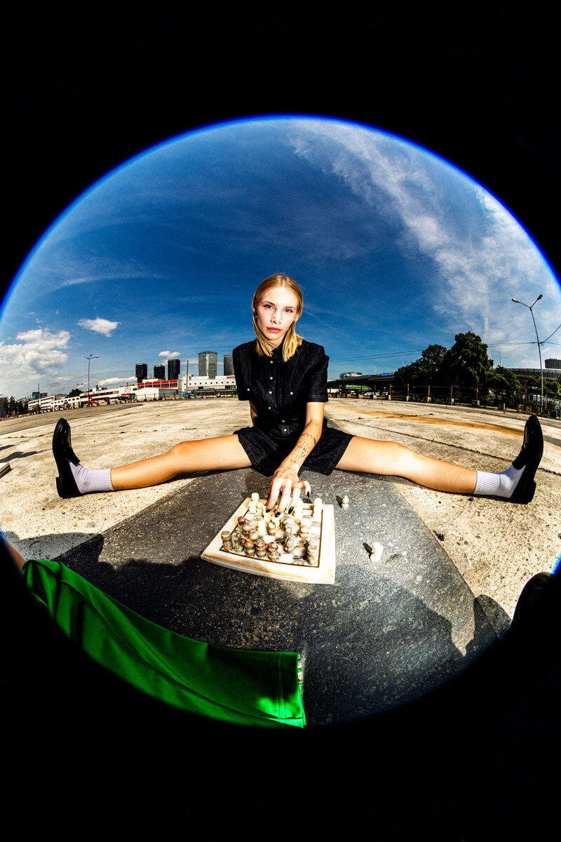 girl sitting on floor, playing chess