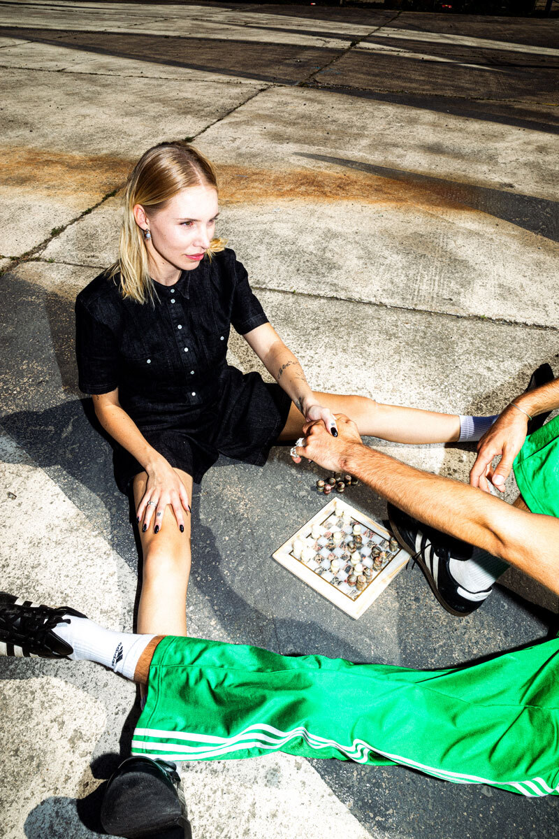 girl shaking hands over a chess game