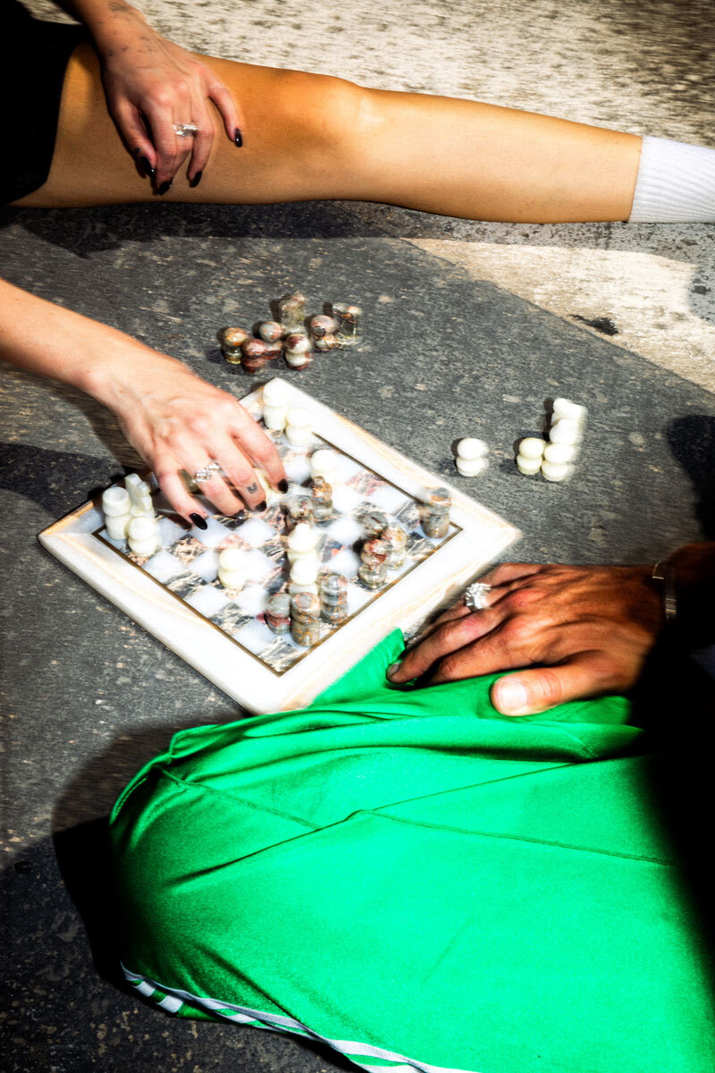 girl moving her chess figure