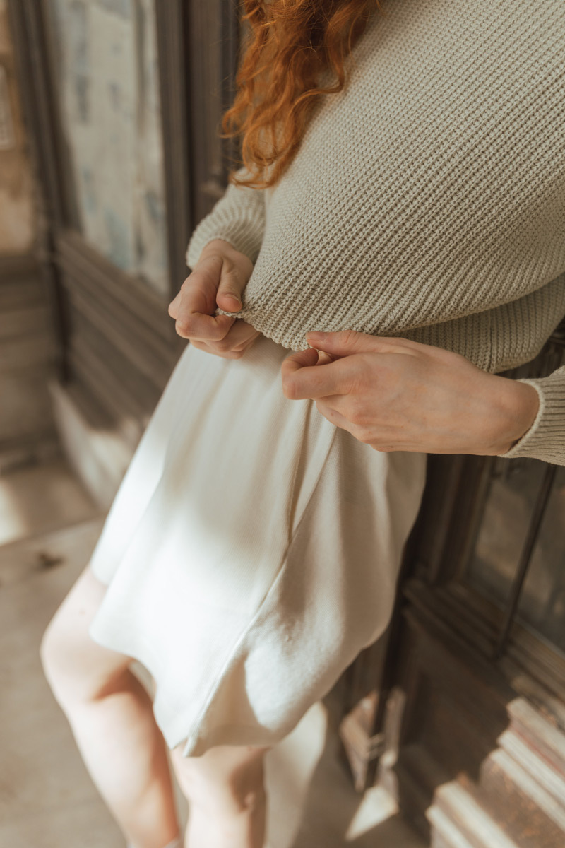 Close Up shot of clothing, mild geen sweater